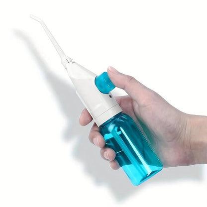 High - Pressure Portable Oral Irrigator Effectively removes food residue and plaque using powerful water pressure. Manual, easy to use, and perfect for deep teeth and gum cleaning at home or on the go. - VELORA